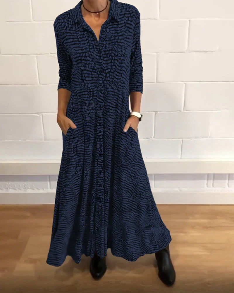 Eleanora - elegant lang trapezkjole med lommer og knapdetaljer