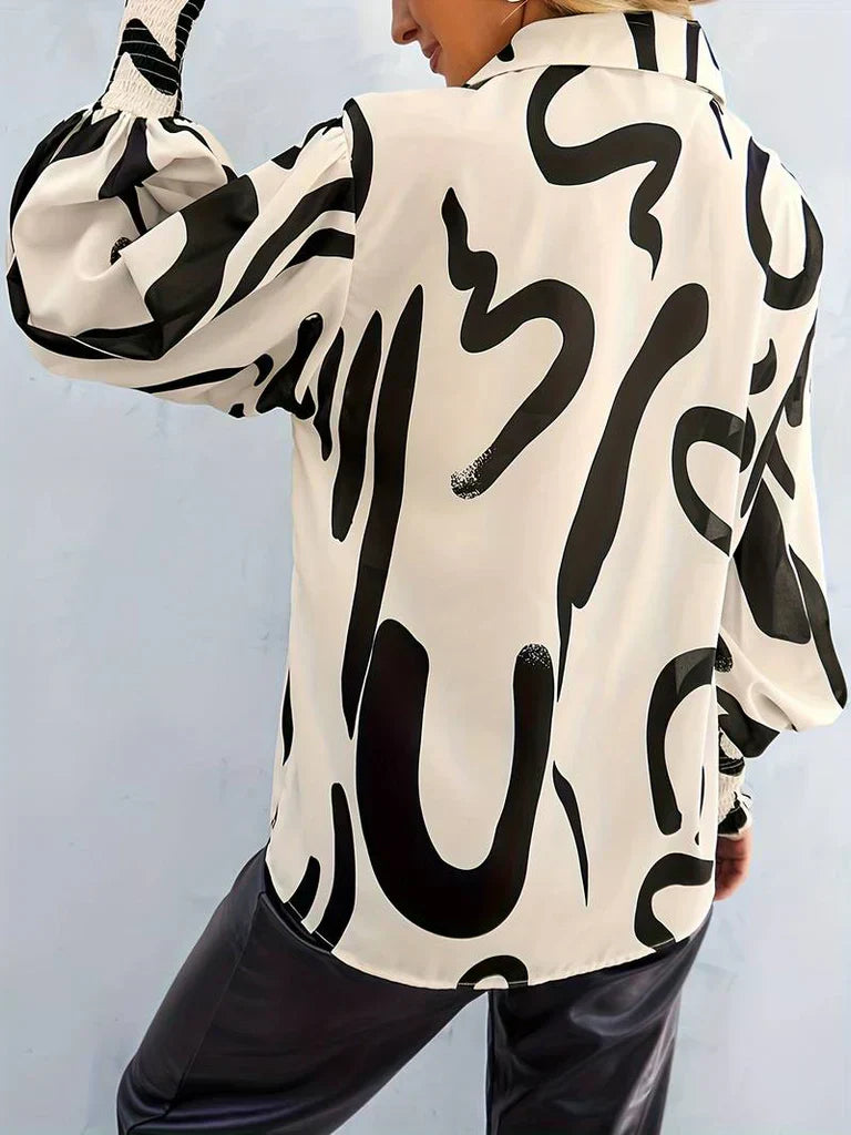 Elegant damebluse med luksuriøst design og plisserede ærmer